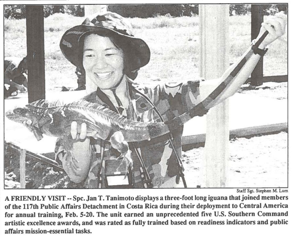 A FRIENDLY VISIT -- Spc. Jan T. Tanimoto displays a three-foot long iguana that joined members of the 117th Public Affairs Detachment in Costa Rica during their deployment to Central America for annual training, Feb. 5-20. The unit earned an unprecedented five U.S. Southern Command artistic excellence awards, and was rated as fully trained based on readiness indicators and public affairs mission-essential tasks.