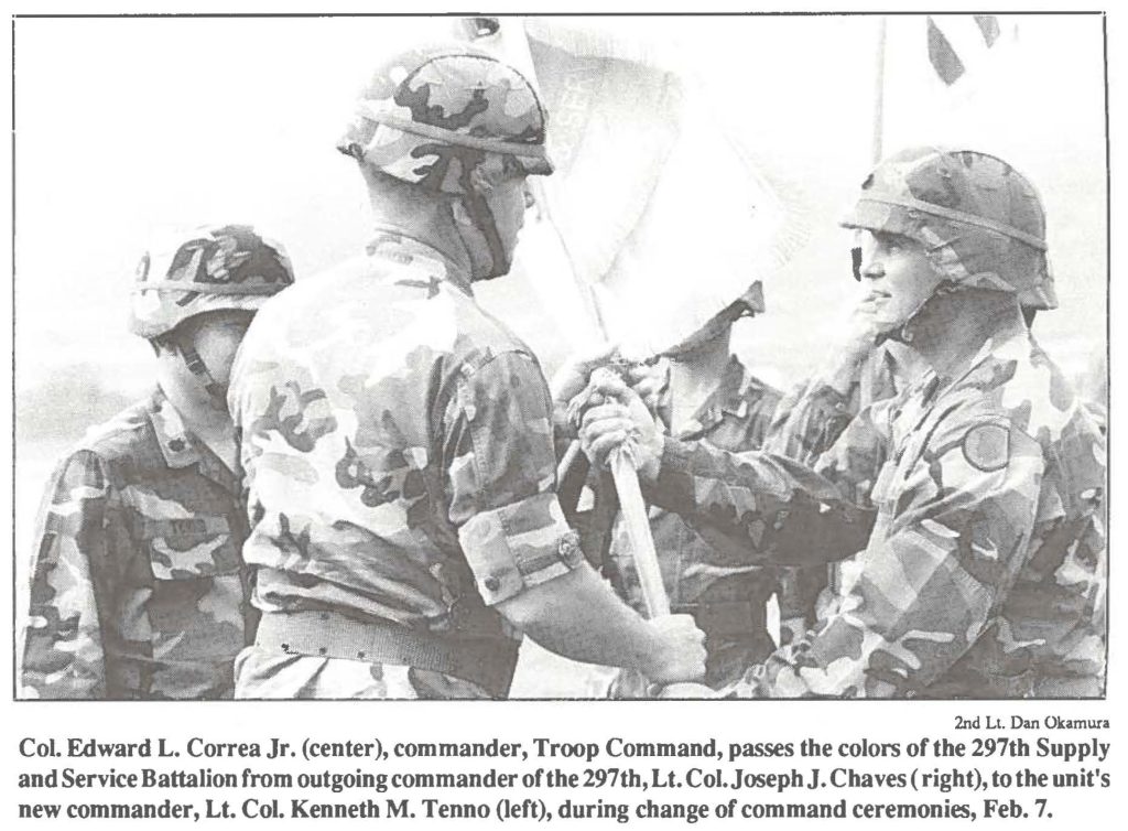 Col. Edward L. Correa Jr. (center), commander, Troop Command, passes the colors of the 297th Supply and Service Battalion from outgoing commander of the 297th, Lt. Col.Joseph J. Chaves ( right), to the unit's new commander, Lt. Col. Kenneth M. Tenno (left), during change of command ceremonies, Feb. 7.