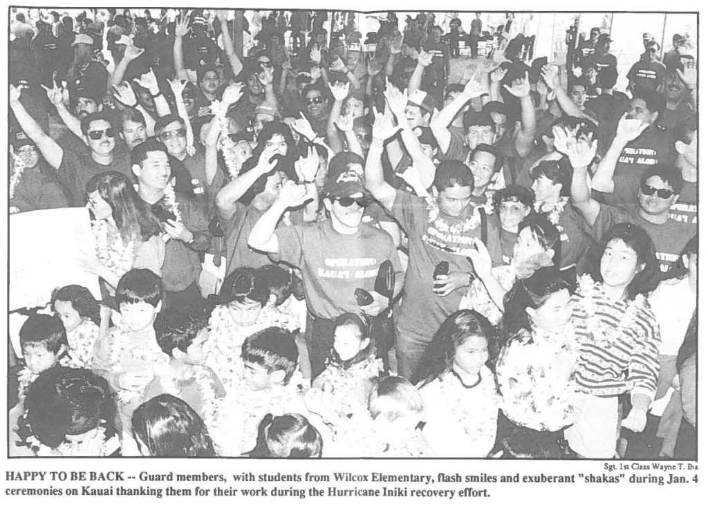 HAPPY TO BE BACK -- Guard members, with students from Wilcox Elementary, flash smiles and exuberant "shakas" during Jan. 4 ceremonies on Kauai thanking them for their work during the Hurricane lniki recovery effort.