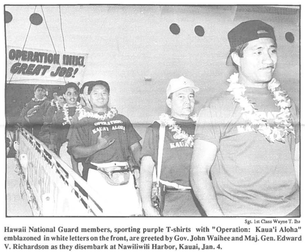 Hawaii National Guard members, sporting purple T-shirts with "Operation: Kaua'i Aloha" emblazoned in white letters on the front, are greeted by Gov. John Waihee and Maj. Gen. Edward V. Richardson as they disembark at Nawiliwili Harbor, Kauai, Jan. 4.