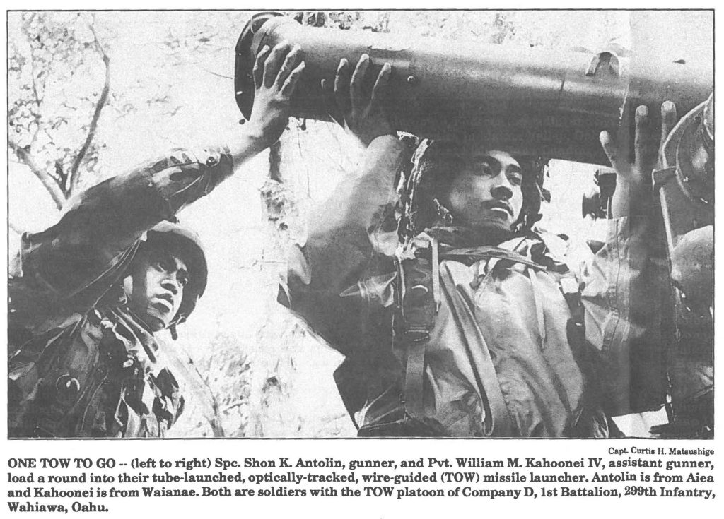 ONE TOW TO GO -- (left to right) Spc. Shon K. Antolin, gunner, and Pvt. William M. Kahoonei IV, as load a round into their tube-launched, optically-tracked, wire-guided (TOW) missile launcher. Antolin and Kahoonei is from Waianae. Both are soldiers with the TOW platoon of Company D, 1st Battalion, Wahiawa, Oahu.