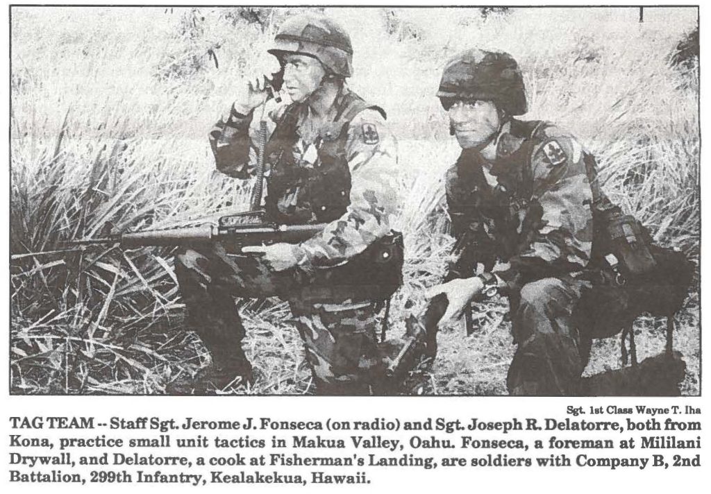 TAG TEAM Staff Sgt. Jerome J. Fonseca (on radio) and Sgt. Joseph R. Delatorre, both from Kona, practice small unit tactics in Makua Valley, Oahu. Fonseca, a foreman at Mililani Drywall, and Delatorre, a cook at Fisherman's Landing, are soldiers with Company B, 2nd Battalion, 299th Infantry, Kealakekua, Hawaii.