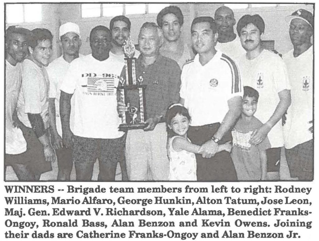 WINNERS -- Brigade team members from left to right: Rodney Williams, Mario Alfaro, George Hunkin, Alton Tatum, Jose Leon, Maj. Gen. Edward V. Richardson, Yale Alama, Benedict Franks-Ongoy, Ronald Bass, Alan Benzon and Kevin Owens. Joining their dads are Catherine Franks-Ongoy and Alan Benzon Jr.