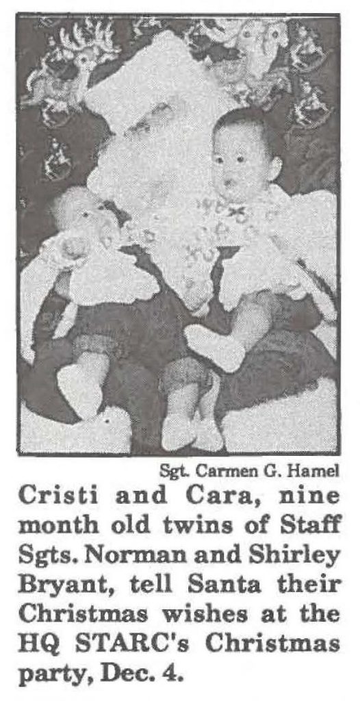 Cristi and Cara, nine month old twins of Staff Sgts. Norman and Shirley Bryant, tell Santa their Christmas wishes at the HQ STARC's Christmas party, Dec. 4.