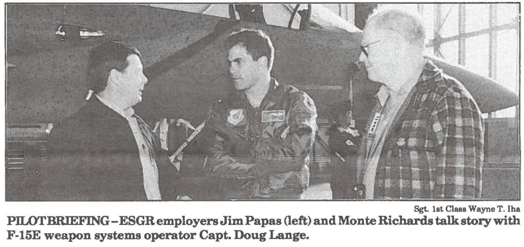 PILOT BRIEFING- ESGR employers Jim Papas (left) and Monte Richards talk story with F-15E weapon systems operator Capt. Doug Lange.