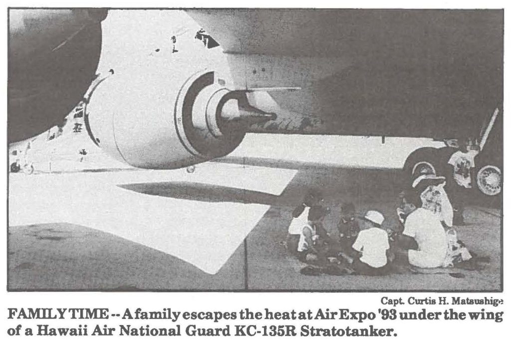 FAMILY TIME--A family escapes the heat at Air Expo '93 under the wing of a Hawaii Air National Guard KC-135R Stratotanker.
