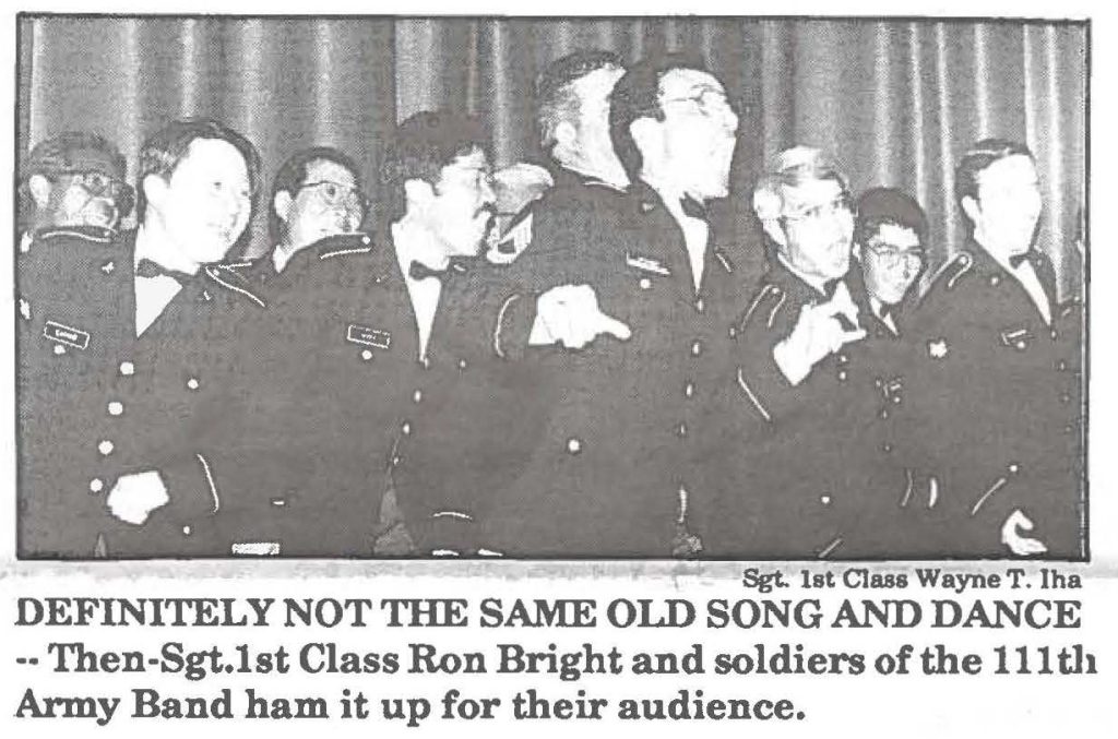 DEFINITELY NOT THE SAME OLD SONG AND DANCE-- Then-Sgt.1st Class Ron Bright and soldiers of the 111th Army Band ham it up for their audience.