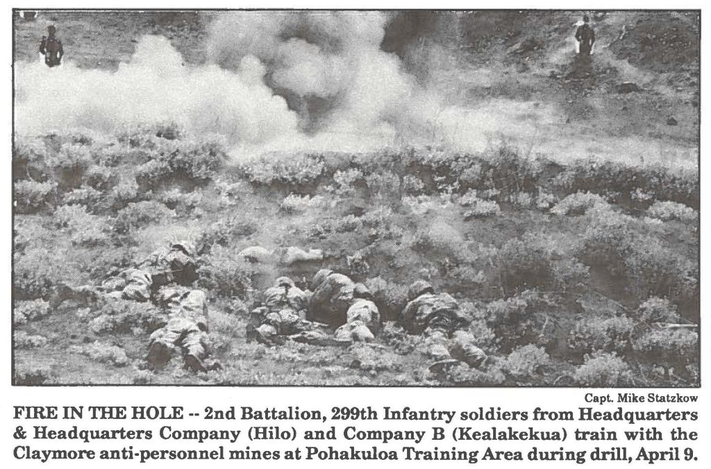 FIRE IN TIIE HOLE -- 2nd Battalion, 299th Infantry soldiers from Headquarters & Headquarters Company (Hilo) and Company B (Kealakekua) train with the Claymore anti-personnel mines at Pohakuloa Training Area during drill, April 9.