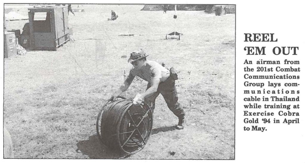 REEL 'EM OUT An airman from the 201st Combat Communications Group lays communications cable in Thailand while training at Exercise Cobra Gold '94 in April to May