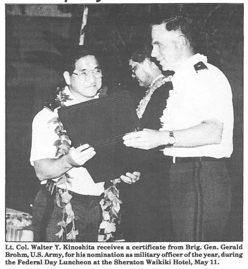 Lt. Col. Walter Y. Kinoshita receives a certificate from Brig. Gen. Gerald Brohm, U.S. Army, for his nomination as military officer of the year, during the Federal Day Luncheon at the Sheraton Waikiki Hotel, May 11.