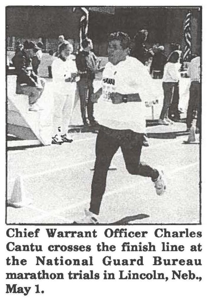 Chief Warrant Officer Charles Cantu crosses the finish line at the National Guard Bureau marathon trials in Lincoln, Neb., May 1.