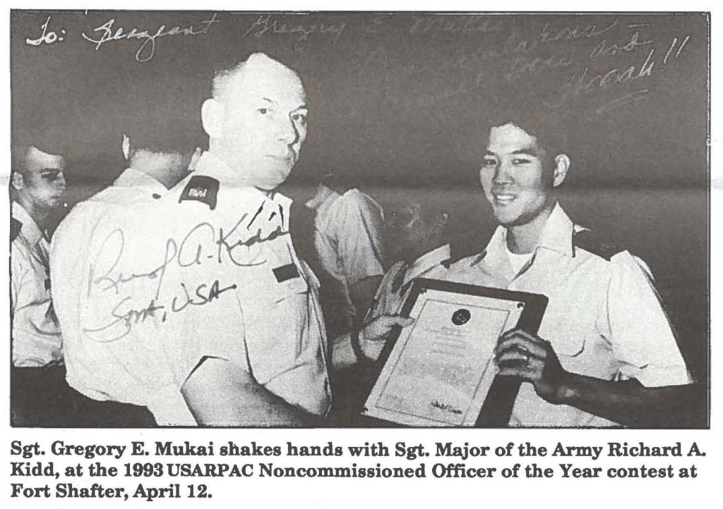 Sgt. Gregory E. Mukai shakes hands with Sgt. Major of the Army Richard A. Kidd, at the 1993 USARPAC Noncommissioned Officer of the Year contest at Fort Shafter, April 12.