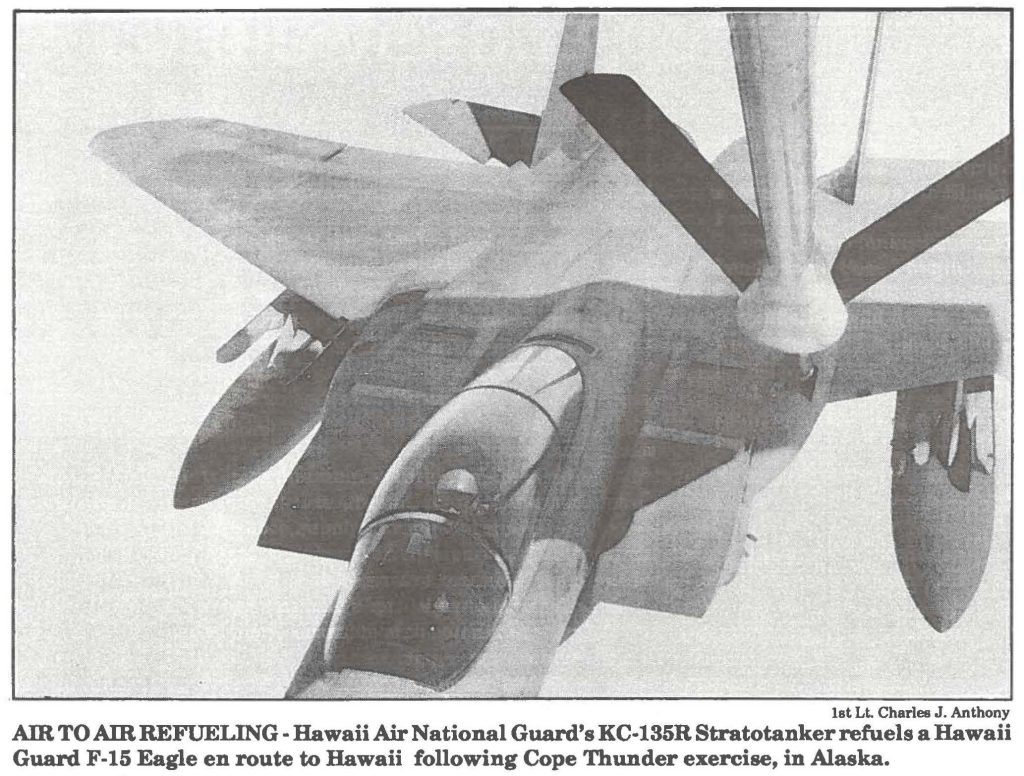 AIR TO AIR REFUELING- Hawaii Air National Guard's KC-135R Stratotanker refuels a Hawaii Guard F-15 Eagle en route to Hawaii following Cope Thunder exercise, in Alaska.