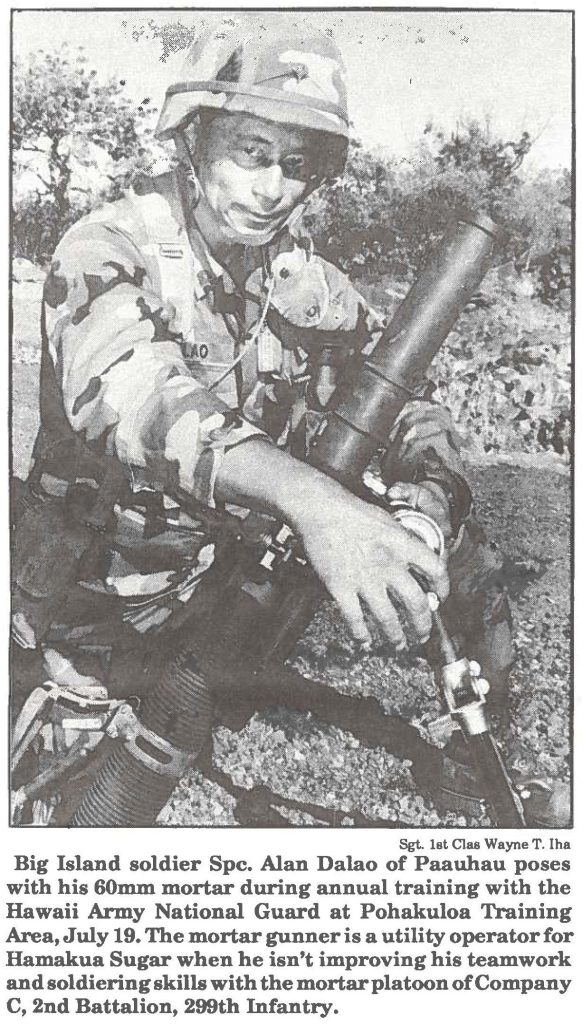 Big Island soldier Spc. Alan Dalao of Paauhau poses with his 60mm mortar during annual training with the Hawaii Army National Guard at Pohakuloa Training Area, July 19. The mortar gunner is a utility operator for Hamakua Sugar when he isn't improving his teamwork and soldiering skills with the mortar platoon of Company C, 2nd Battalion, 299th Infantry.