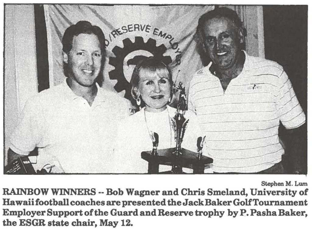 RAINBOW WINNERS--Bob Wagner and Chris Smeland, University of Hawaii football coaches are presented the Jack Baker Golf Tournament Employer Support of the Guard and Reserve trophy by p. Pasha Baker, the ESGR state chair, May 12.