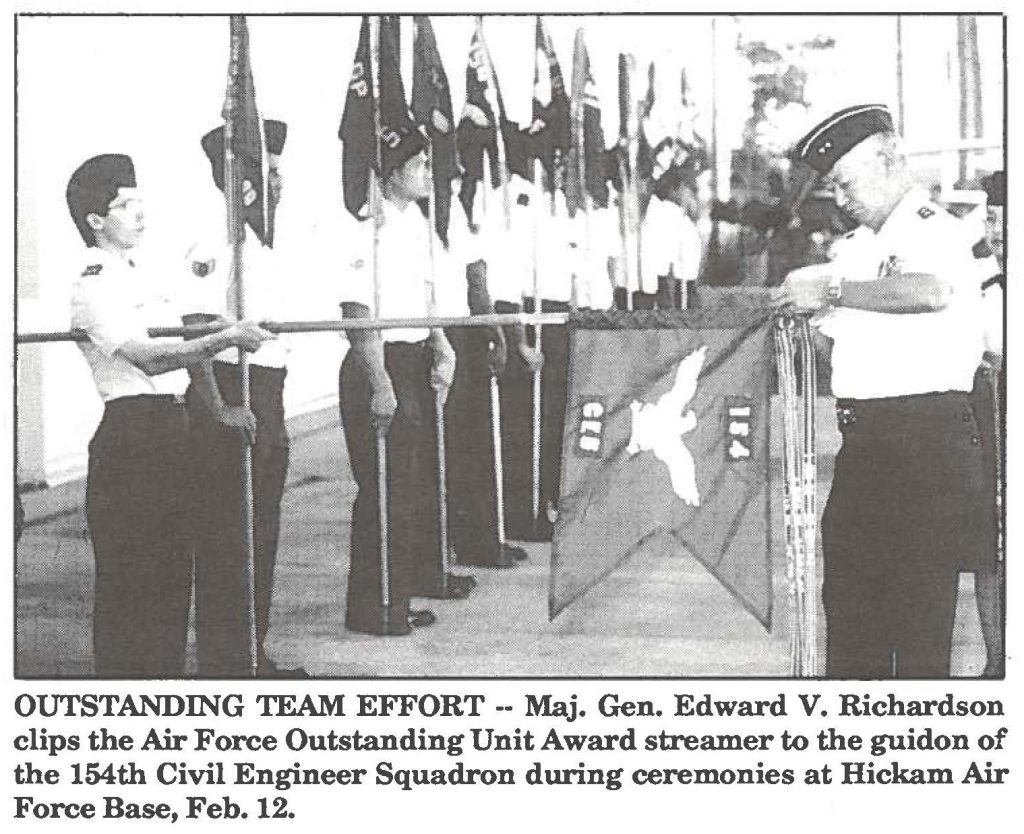OUTSTANDING TEAM EFFORT -· Maj. Gen. Edward V. Richardson clips the Air Force Outstanding Unit Award streamer to the guidon of the 154th Civil Engineer Squadron during ceremonies at Hickam Air Force Base, Feb. 12.