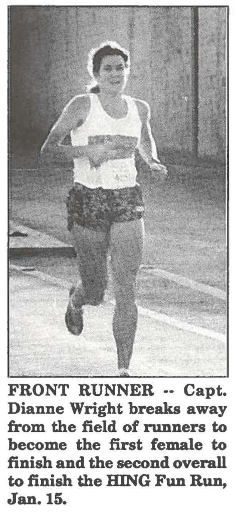 FRONT RUNNER -- Capt. Dianne Wright breaks away from the field of runners to become the first female to finish and the second overall to finish the HING Fun Run, Jan. 15