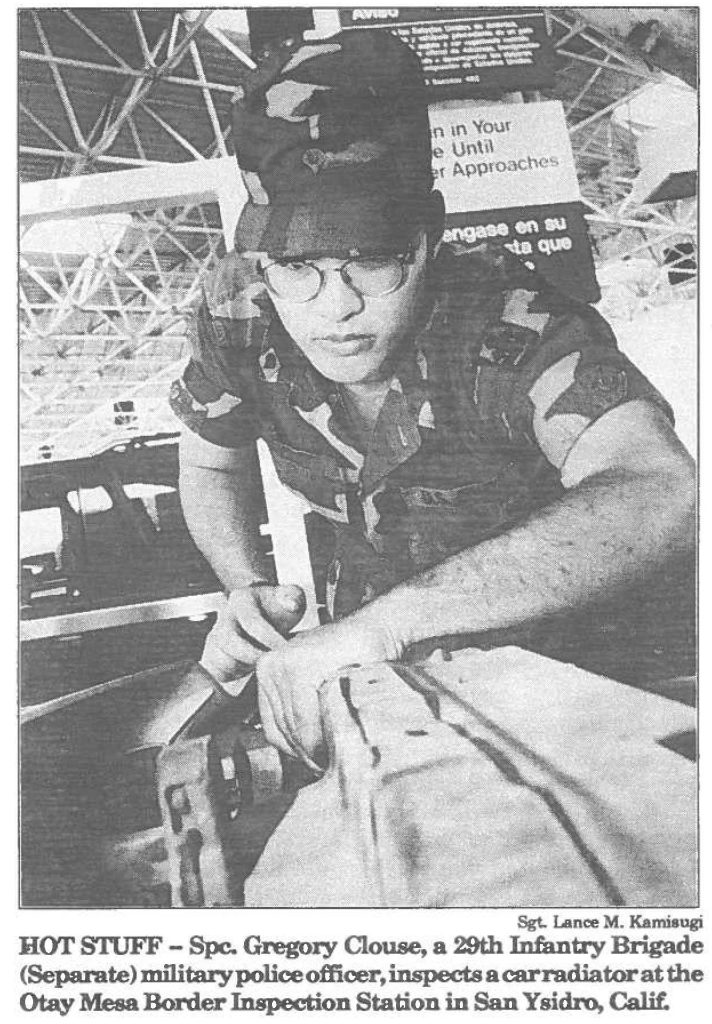 HOT STUFF - Spc. Gregory Couse, a 29th Infantry Brigade (Separate) military police officer, inspects a car radiator at the Otay Mesa Border Inspection Station in San Ysidro, Calif.