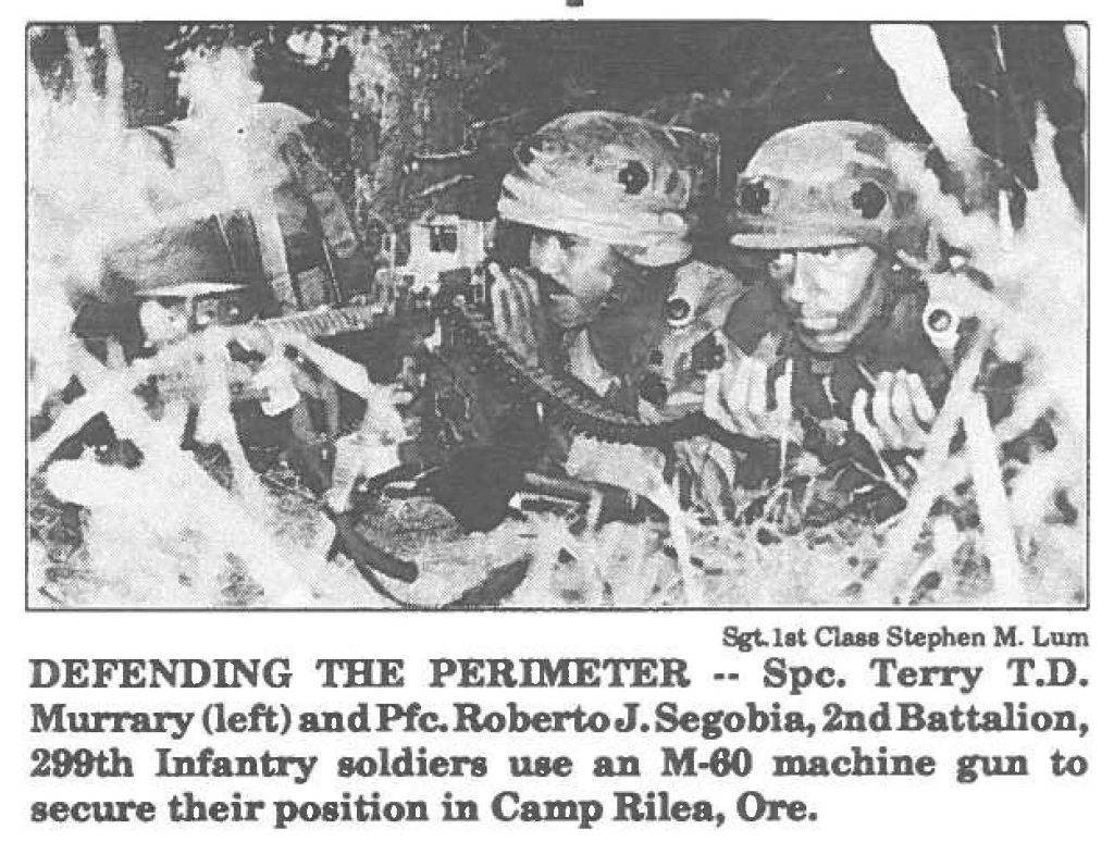 DEFENDING THE PERIMETER -- Spc. Terry T.D. Murrary (left) and Pfc. Roberto J. Segobia, 2nd Battalion, 299th Infantry soldiers use an M-80 machine gun to secure their position in Camp Rilea, Ore.