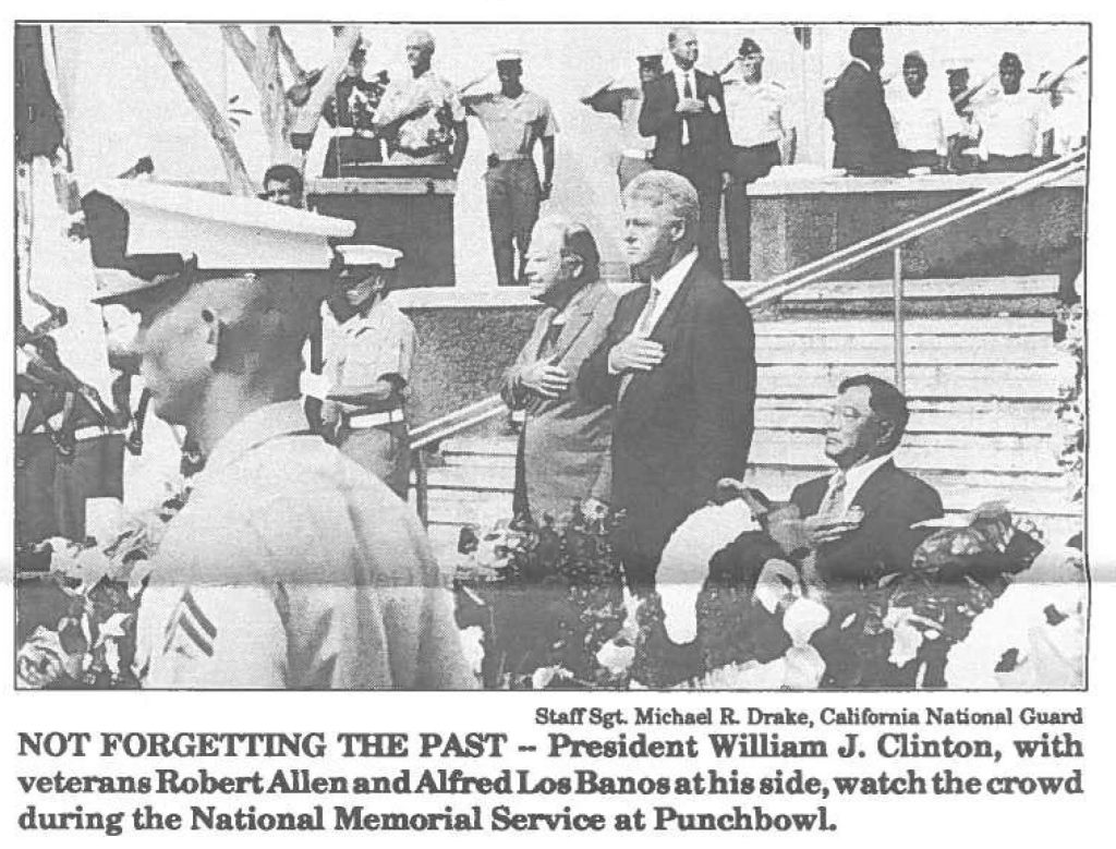 NOT FORGETTING THE PAST - President William J. Clinton, with veterans Robert Allen and Alfred LosBanos at his side, watch the crowd during the National Memorial Service at Punchbowl.