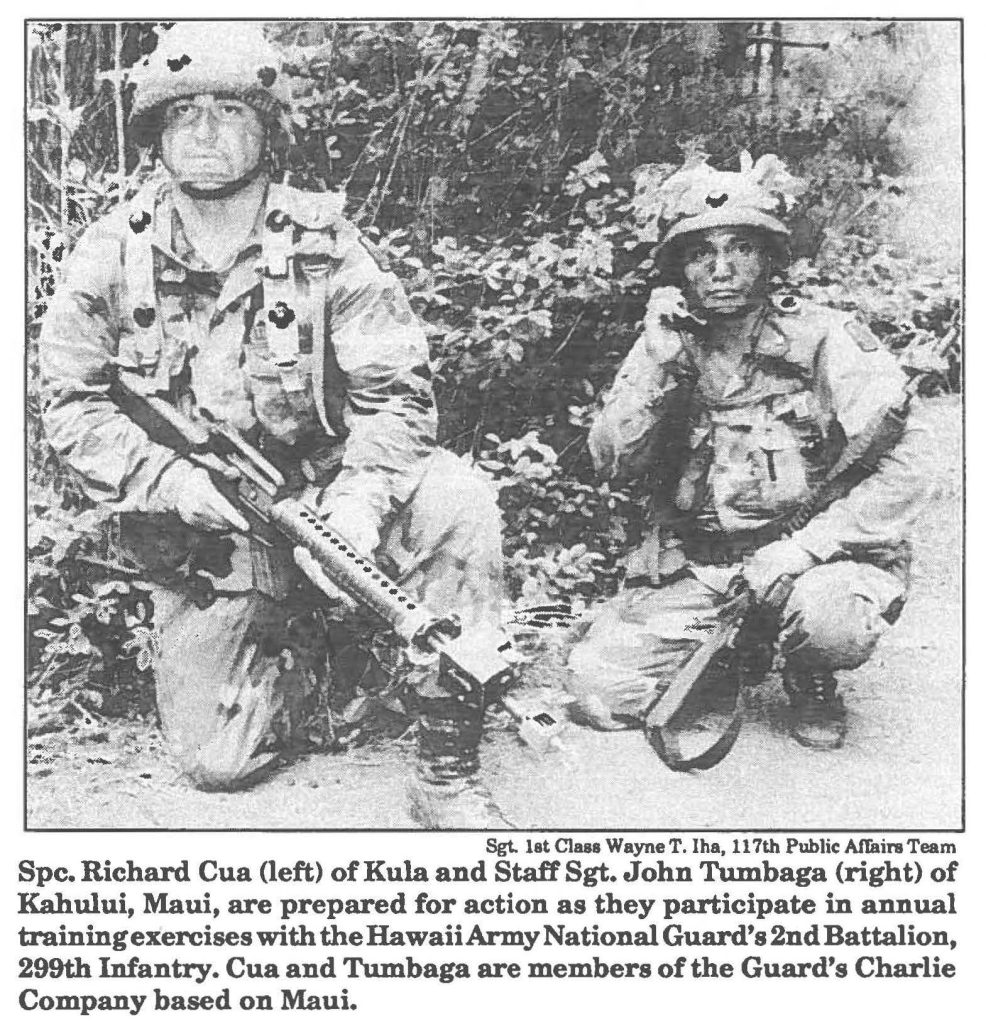 Spc. Richard Cua (left) of Kula and Staff Sgt. John Tumbaga (right) of Kahului, Maui, are prepared for action as they participate in annual training exercises with the Hawaii Army National Guard's 2nd Battalion, 299th Infantry. Cua and Tumbaga are members of the Guard's Charlie Company based on Maui.