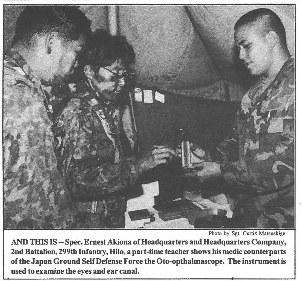 AND THlS IS - Spec. Ernest Akiona of Headquarters and Headquarters Company, 2nd Battalion, 299th Infantry, Hilo, a part-time teacher shows his medic counterparts of the Japan Ground Self Defense Force the Oto-opthalmascope. The instrument is used to examine the eyes and ear canal.