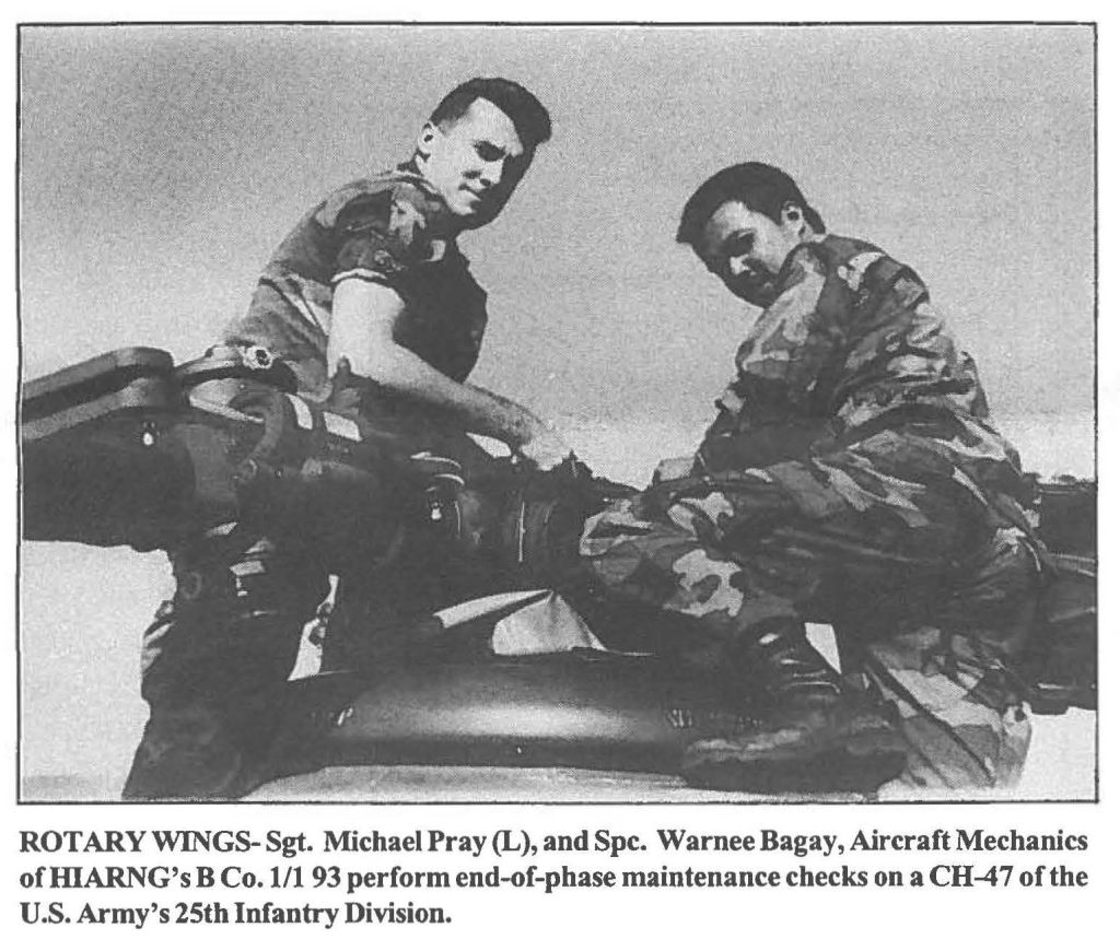 ROTARY WINGS- Sgt. Michael Pray (L), and Spc. Warnee Bagay, Aircraft Mechanics of HIARNG's B Co.1/1 93 perform end-of-phase maintenance checks on a CH-47 of the U.S. Army's 25th Infantry Division.