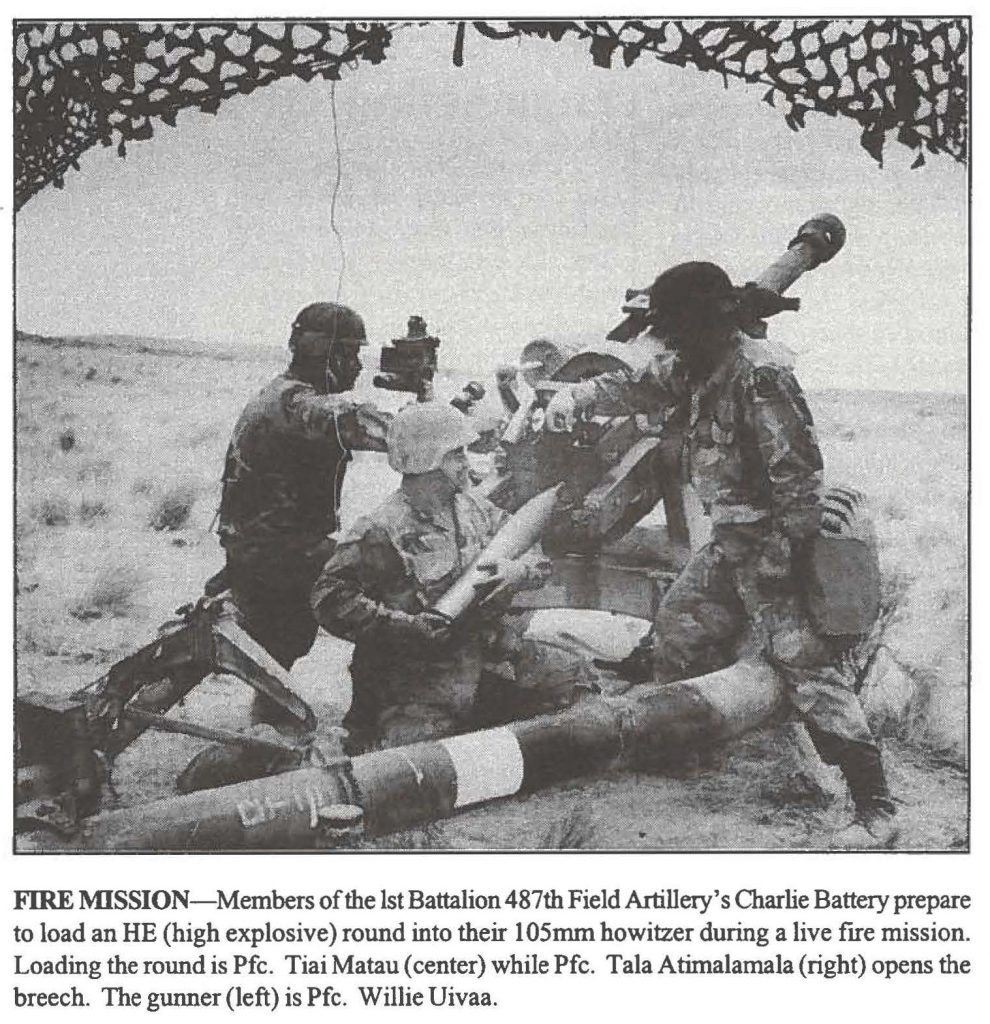 FIRE MISSION-Members of the 1st Battalion 487th Field Artillery's Charlie Battery prepare to load an HE (high explosive) round into their 105mm howitzer during a live fire mission. Loading the round is Pfc. Tiai Matau ( center) while Pfc. Tala Atimalamala (right) opens the breech. The gunner (left) is Pfc. Willie Uivaa.