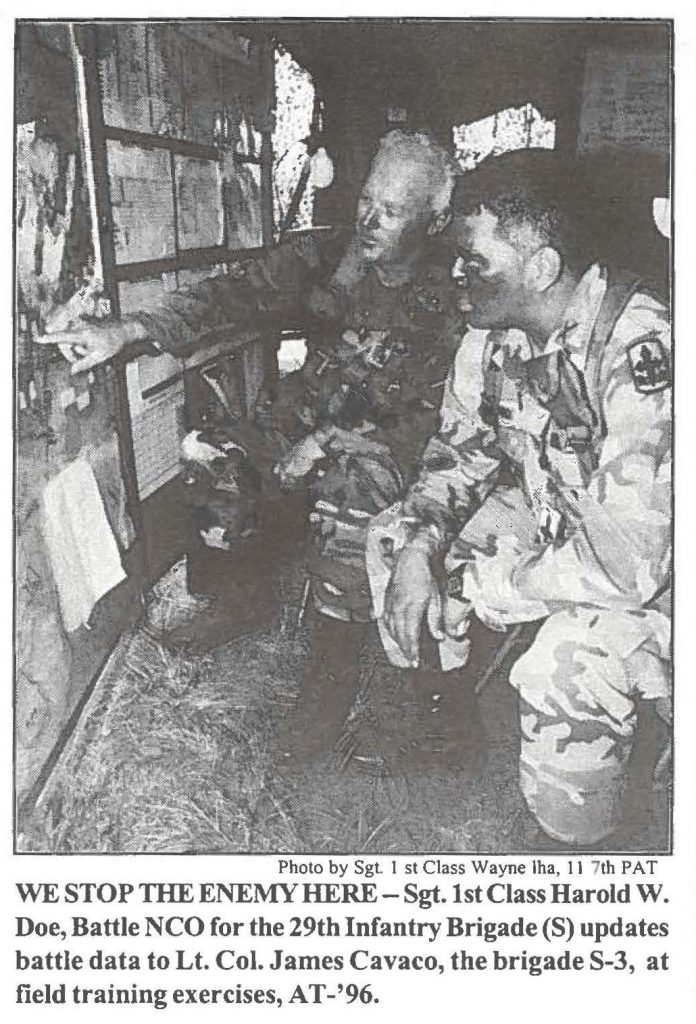 WE STOP THE ENEMY HERE- Sgt.1st Class Harold W. Doe, Battle NCO for the 29th Infantry Brigade (S) updates battle data to Lt. Col. James Cavaco, the brigade S-3, at field training exercises, AT-'96.