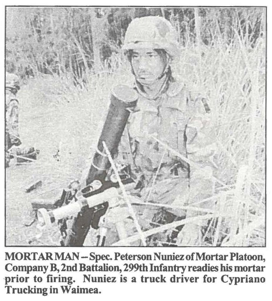 MORTARMAN -Spec. Peterson Nuniez of Mortar Platoon Company B, 2nd Battalion, 299th Infantry readies his mortar prior to firing. Nuniez is a truck driver for Cypriano Trucking in Waimea.