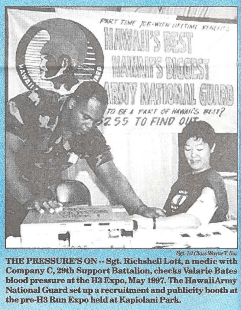 THE PRESSURE'S ON -- Sgt. Richshell Lott, a medic with Company C, 29th Support Battalion, checks Valarie Bates blood pressure at the H3 Expo, May 1997. The Hawaii Army National Guard set up a recruitment and publicity booth at the pre-H3 Run Expo held at Kapiolani Park.
