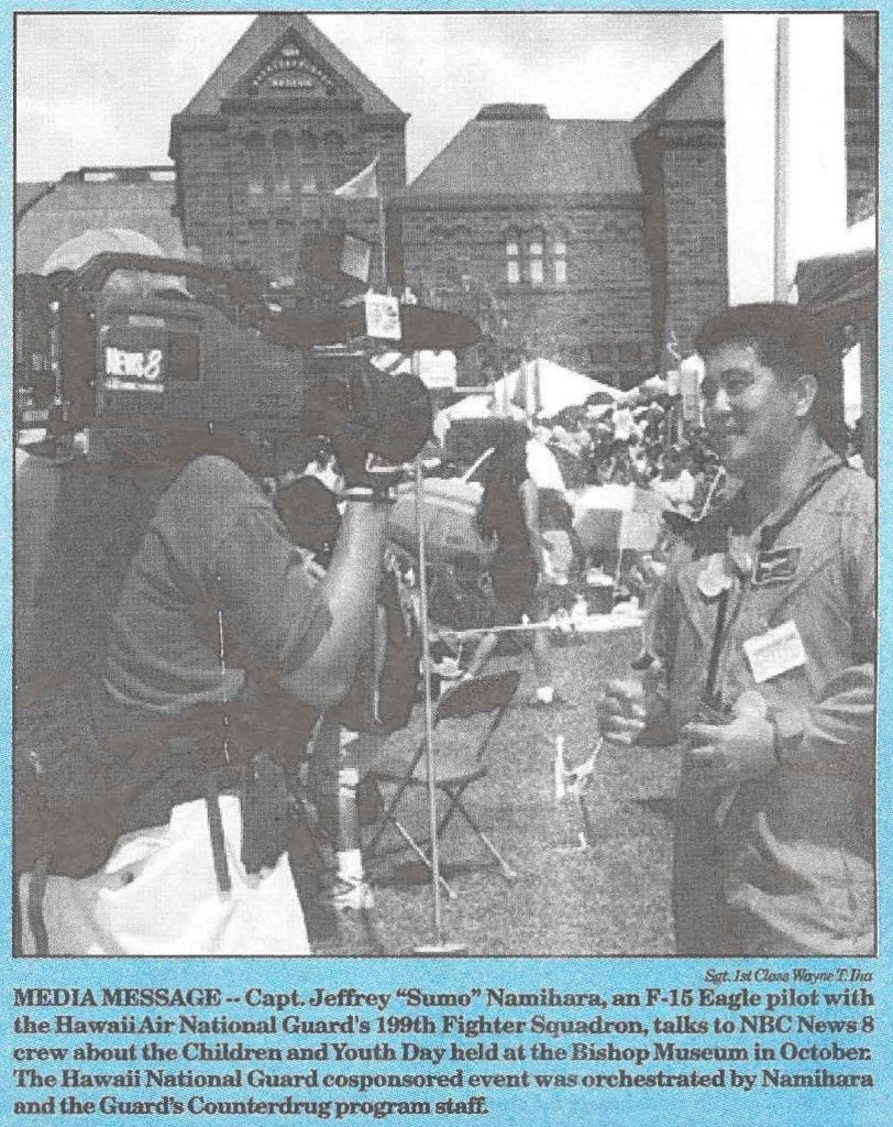 MEDIA MESSAGE -- Capt. Jeffery "Sumo" Namihara, an F-15 Eagle pilot with the Hawaii Air National Guard's 199th Fighter Squadron, talks to NBC News 8 crew about the children and Youth Day held at the Bishop Museum in October. The Hawaii National Guard cosponsored event was orchestrated by Namihara and the Guard's Counterdrug Program staff.