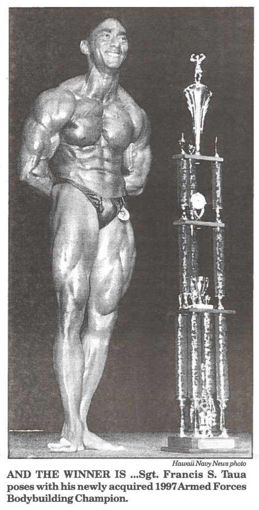 AND THE WINNER IS ... Sgt. Francis S. Taua poses with his newly acquired 1997 Armed Forces Body building Champio