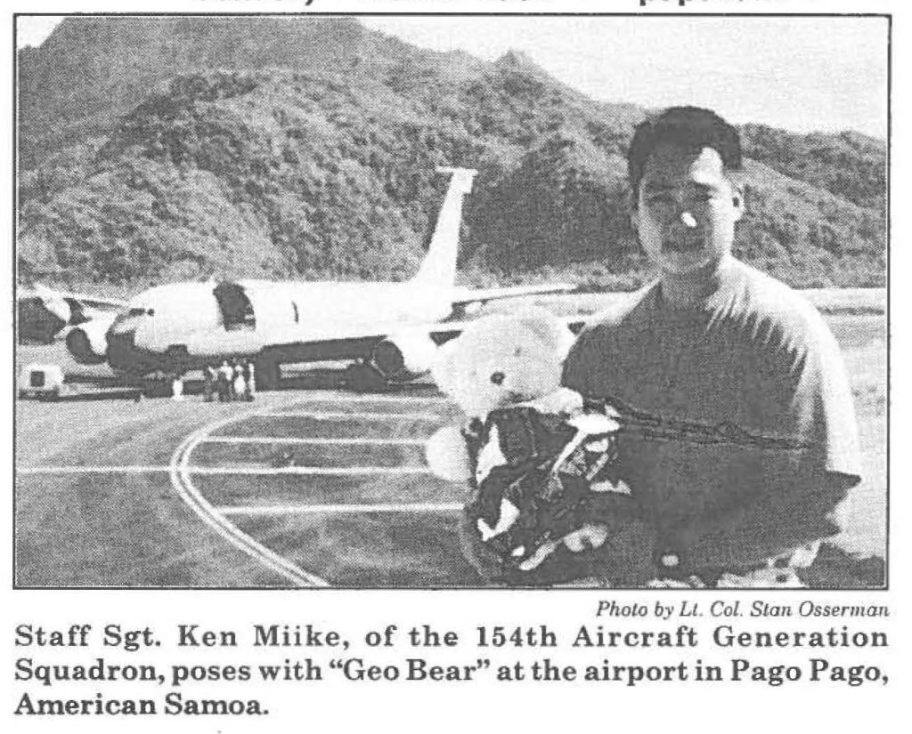 Staff Sgt. Ken Miike, of the 154th Aircraft Generation Squadron, poses with "Geo Bear" at the airport in Pago Pago, American Samoa.