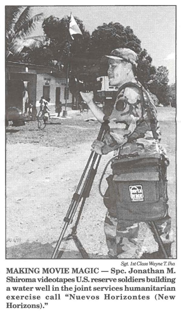 MAKING MOVIE MAGIC - Spc. Jonathan M. Shiroma videotapes U.S. reserve soldiers building a water well in the joint services humanitarian exercise call "Nuevos Horizontes (New Horizons)."