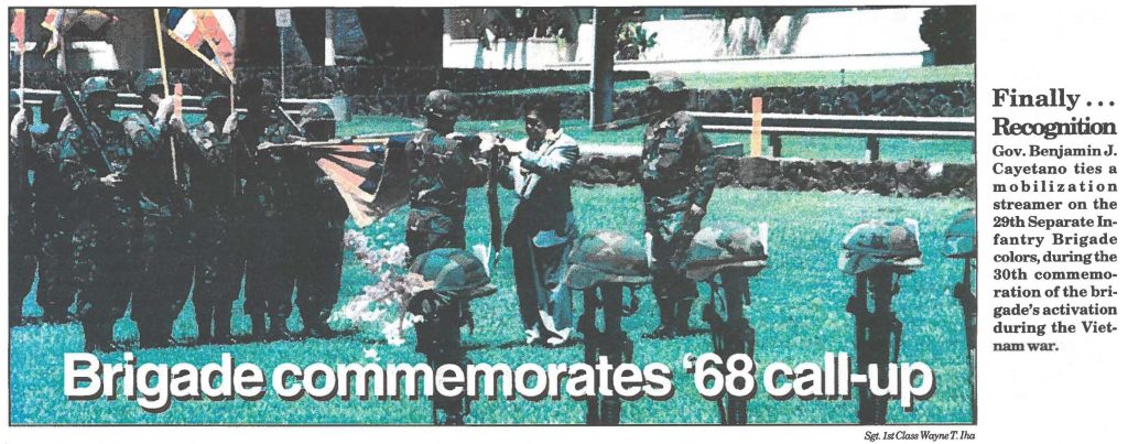 Finally ... Recognition Gov. Benjamin J. Cayetano ties a mobilization streamer on the 29th Separate Infantry Brigade colors, during the 30th commemoration of the brigade's activation during the Vietnam war.