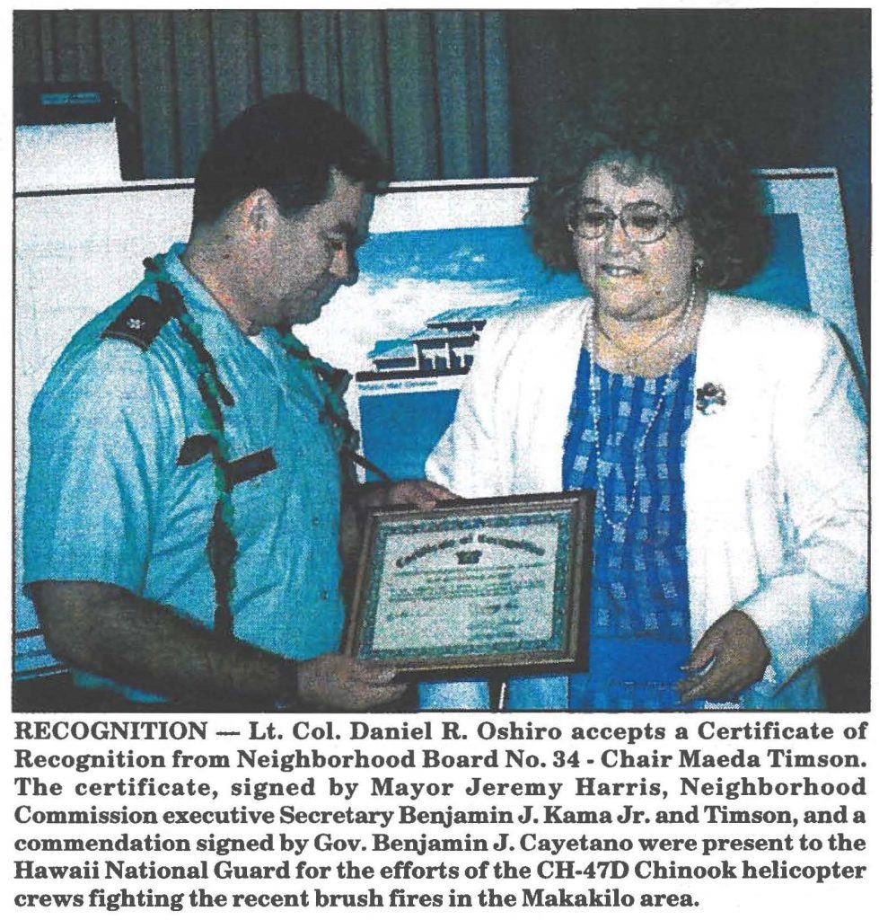 RECOGNITION - Lt. Col. Daniel R. Oshiro accepts a Certificate of Recognition from Neighborhood Board No. 34 - Chair Maeda Timson. The certificate, signed by Mayor Jeremy Harris, Neighborhood Commission executive Secretary Benjamin J. Kama Jr. and Timson, and a commendation signed by Gov. Benjamin J. Cayetano were present to the Hawaii National Guard for the efforts of the CH-47D Chinook helicopter crews fighting the recent brush fires in the Makakilo area.