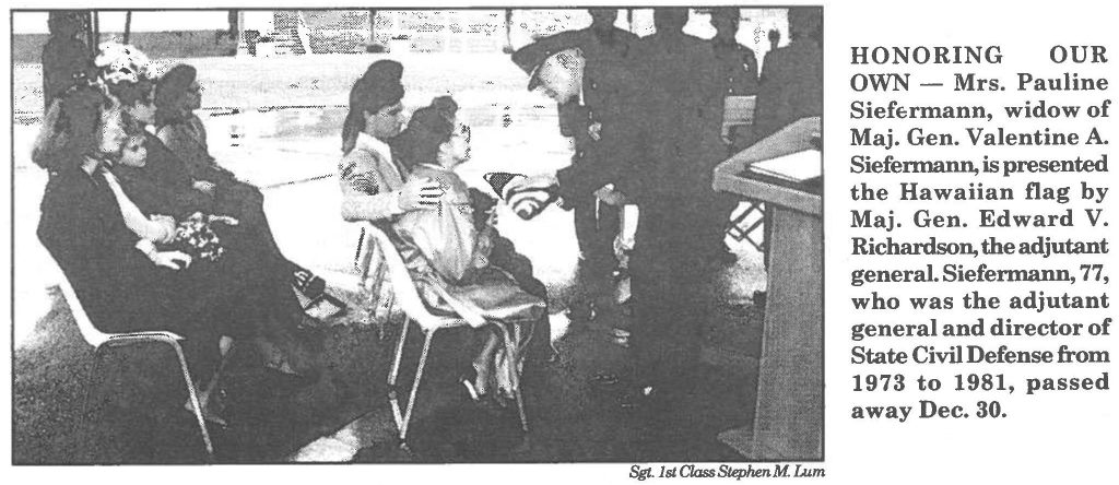 HONORING OUR OWN - Mrs. Pauline Siefermann, widow of Maj. Gen. Valentine A. Siefennann, is presented the Hawaiian flag by Maj. Gen. Edward V.