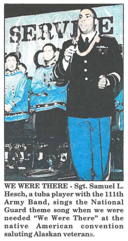 WE WERE THERE - Sgt. Samuel L. Hesch, a tuba player with the 111th Army Band, sings the National Guard theme song when we were needed "We Were There" at the native American convention saluting Alaskan veterans.