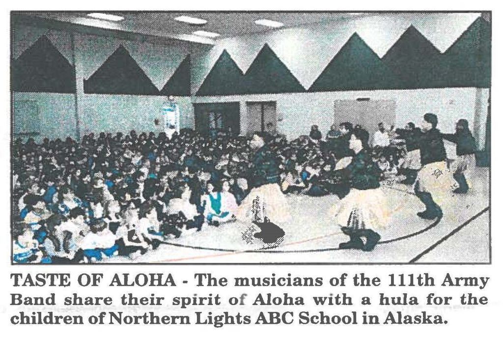 TASTE OF ALOHA - The musicians of the 111th Army Band share their spirit of Aloha with a hula for the children of Northern Lights ABC School in Alaska.