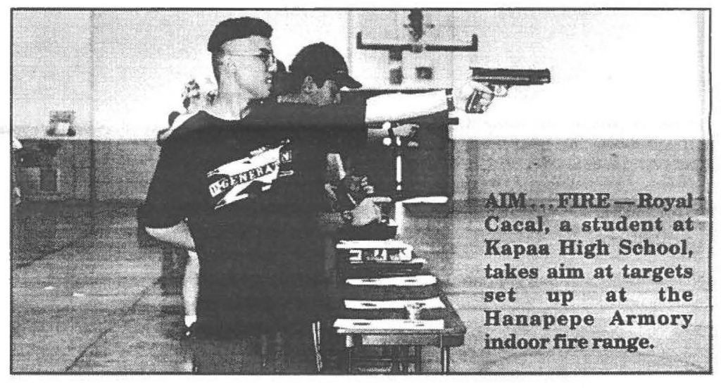 AIM . . . FIRE -- Royal Cacal, a student takes aim at targets set up at the Hanapepe Armory indoor fire range