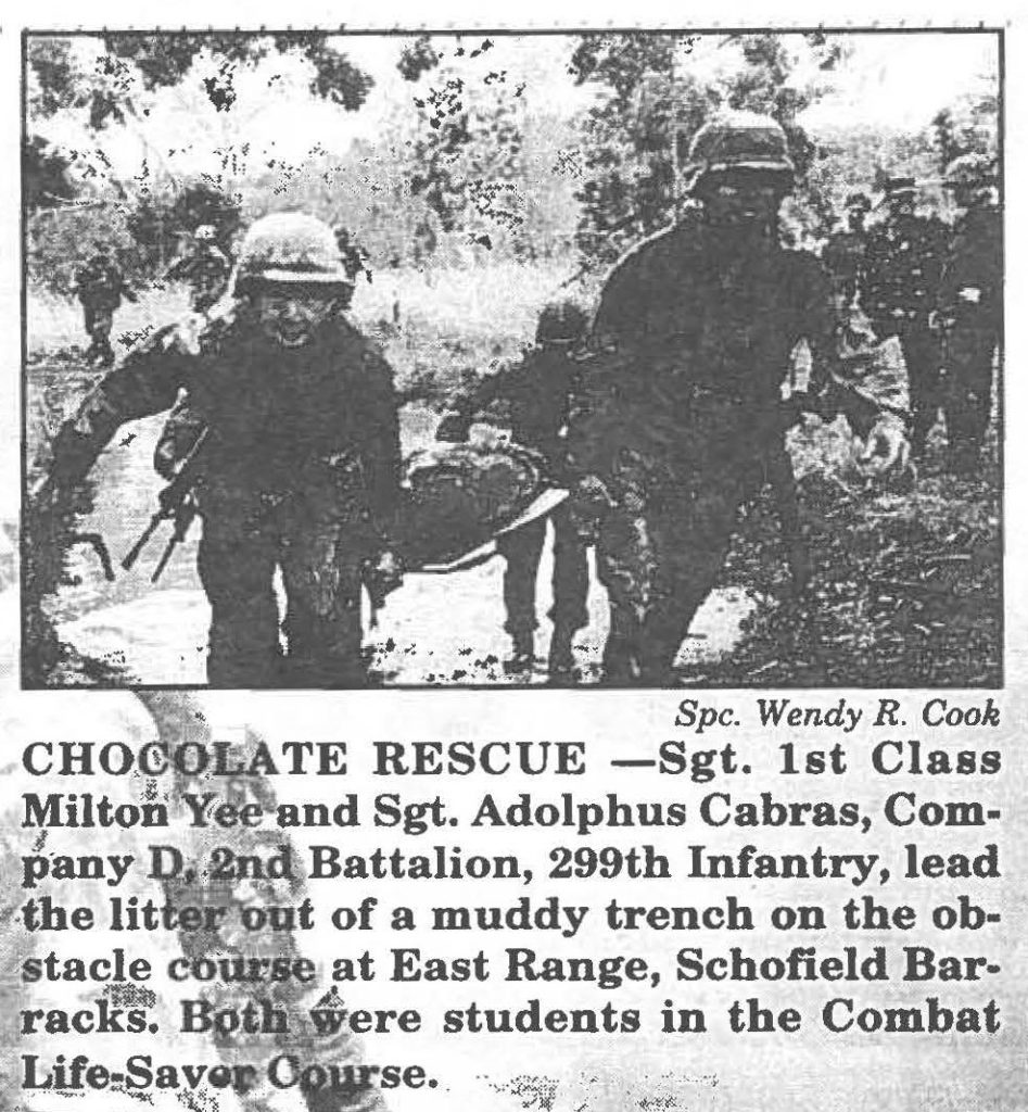 CHOCOLATE RESCUE - Sgt. 1st Class Milton Yee and Sgt. Adolphus Cabras, Company D, 2nd Battalion, 299th Infantry, lead the litter out of a muddy trench on the obstacle course at East Range, Schofield Barracks. Both were students in the Combat Life-Saver Course