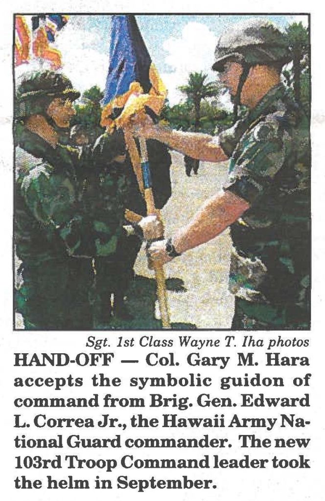 HAND-OFF - Col. Gary M. Hara accepts the symbolic guidon of command from Brig. Gen. Edward L. Correa Jr., the Hawaii Army National Guard commander. The new 103rd Troop Command leader took the helm in September.
