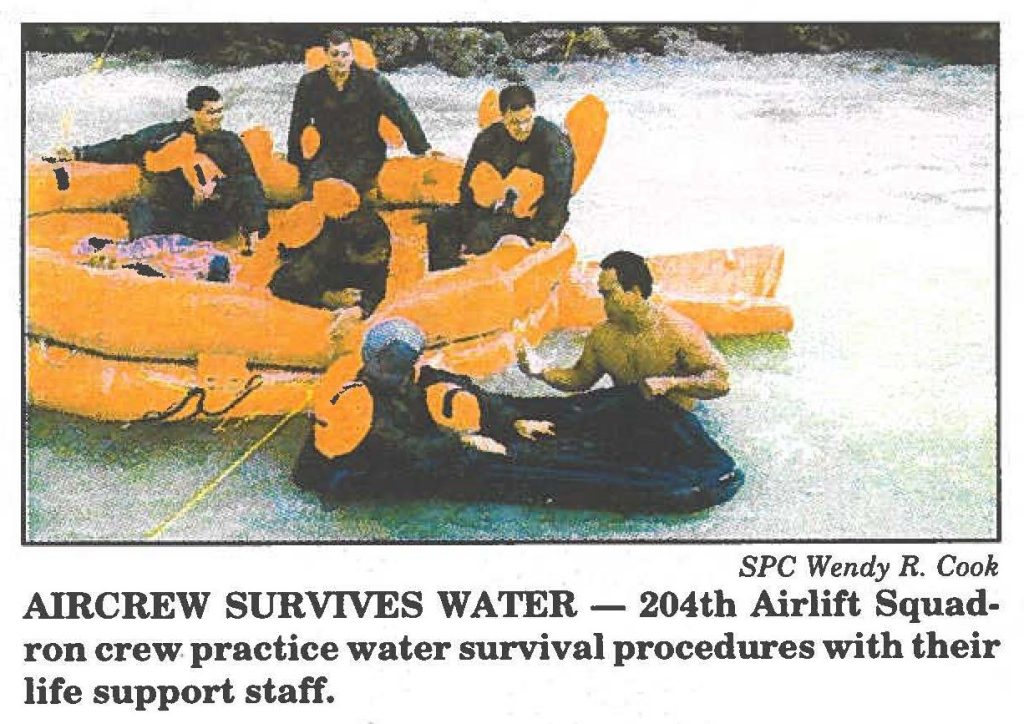 AIRCREW SURVIVES WATER- 204th Airlift Squadron crew practice water survival procedures with their life support staff.