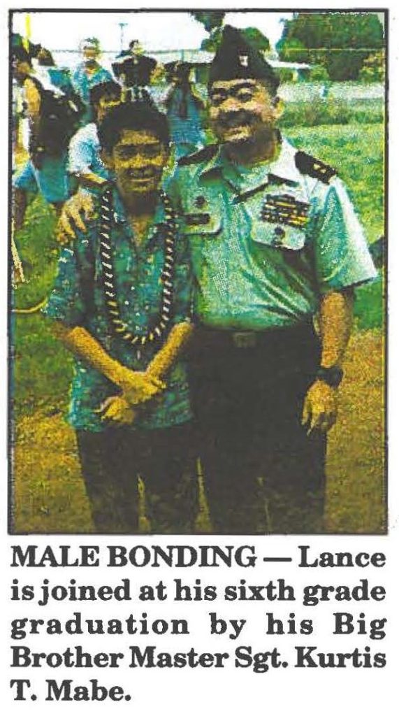 MALE BONDING-Lance is joined at his sixth grade graduation by his Big Brother Master Sgt. Kurtis T. Mabe.