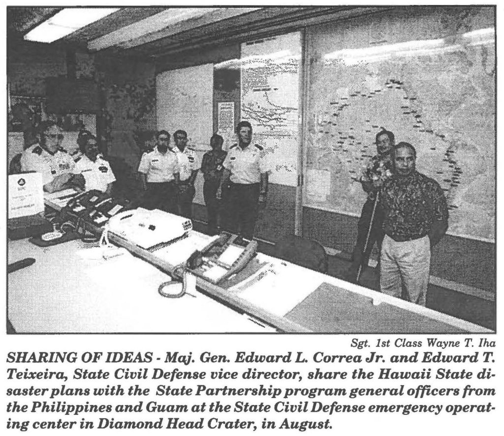SHARING OF IDEAS - Maj. Gen. Edward T. Correa Jr. and Edward T. Teixeira, State Civil Defense vice director, share the Hawaii State disaster plans with the State Partnership program general officers from the Philippines and Guam at the State Civil Defense emergency operating center in Diamond Head Crater, in August.