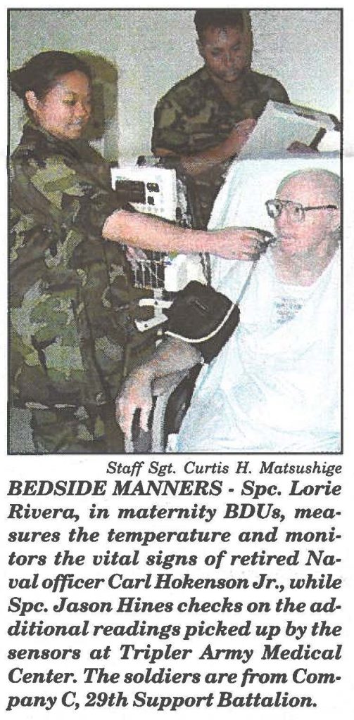 BEDSIDE MANNERS - Spc. Lorie Rivera, in maternity BDUs, measures the temperature and monitors the vital signs of retired Naval officer Carl Hokenson Jr., while Spc. Jason Hines checks on the additional readings picked up by the sensors at Tripler Army Medical Center. The soldiers are from Company C, 29th Support Battalion.