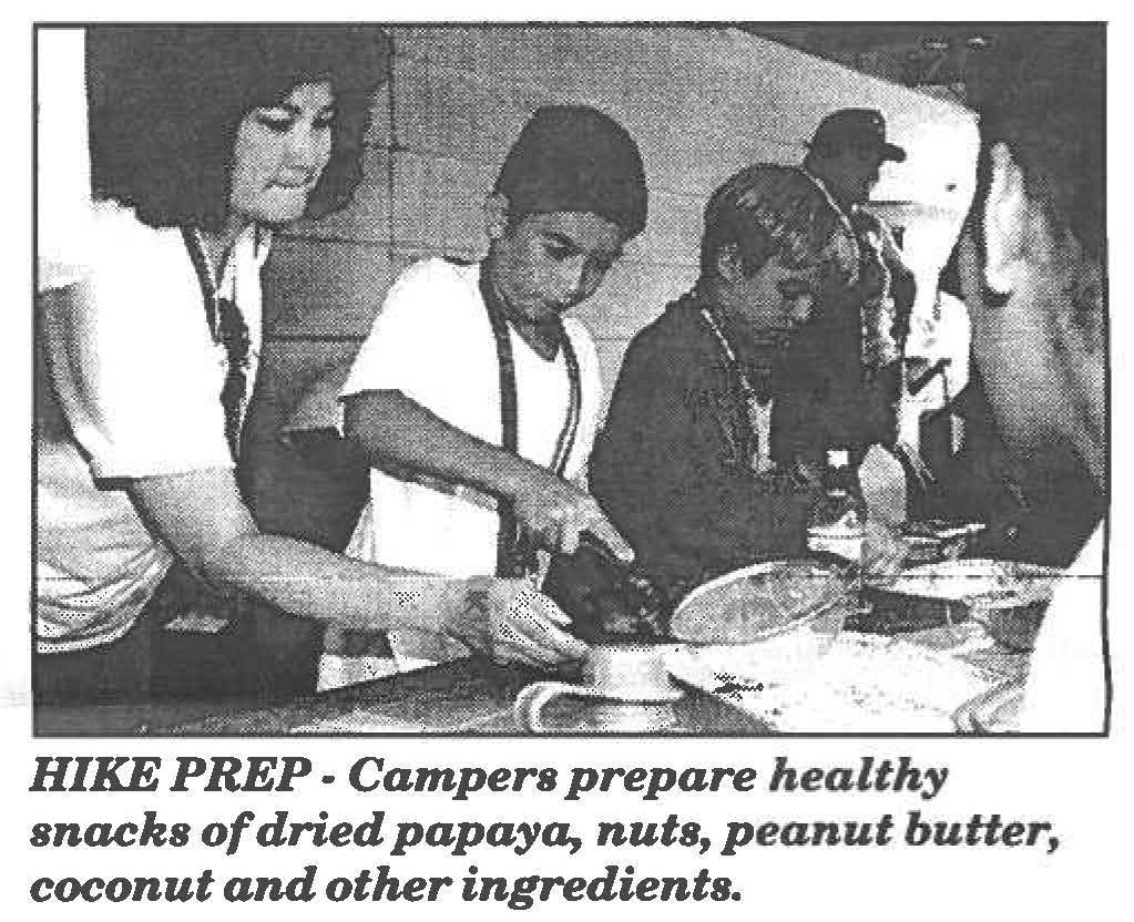 HIKE PREP- Campers prepare healthy snacks of dried papaya, nuts, peanut butter, coconut and other ingredients.