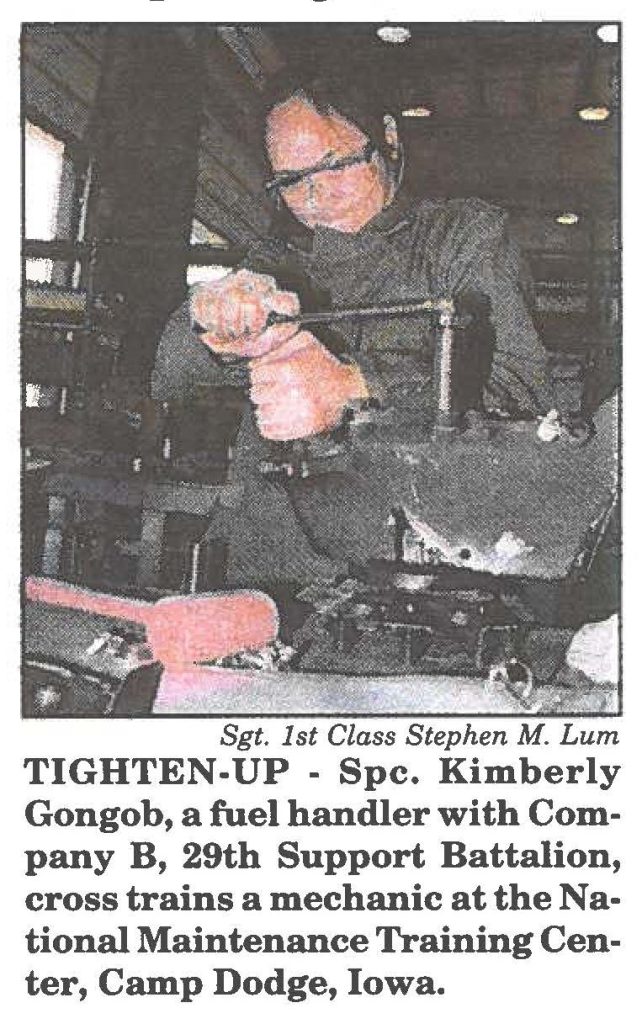 TIGHTEN-UP - Spc. Kimberly Gongob, a fuel handler with Company B, 29th Support Battalion, cross trains a mechanic at the National Maintenance Training Center, Camp Dodge, Iowa.
