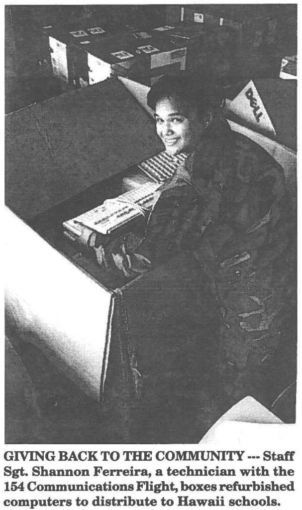 GIVING BACK TO THE COMMUNITY --- Staff Sgt. Shannon Ferreira, a technician with the 154 Communications Flight, boxes refurbished computers to distribute to Hawaii schools.